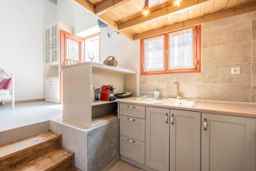 a kitchen with a sink and a counter top at Rodies House in Rhodes Town