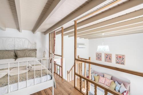a bedroom with a bunk bed and a staircase at Rodies House in Rhodes Town