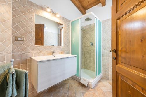 a bathroom with a sink and a shower at Girasole in Pula