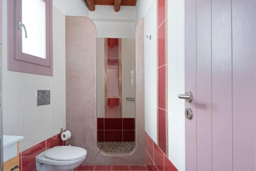 a bathroom with a toilet and a shower at Nicolas House 1 in Rakhídhion