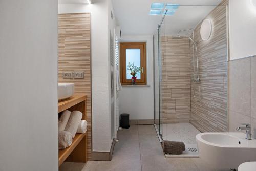 a bathroom with a shower and a sink at Maso Plocech App Vacanze in Pergine Valsugana