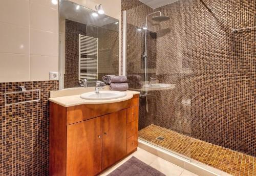 a bathroom with a sink and a shower at Costacabana - Villa Jaruco in Lloret de Mar