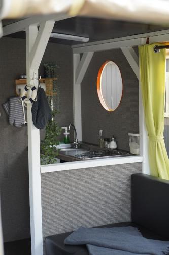 a bathroom with a sink and a mirror at Floss Priepert 1 in Priepert