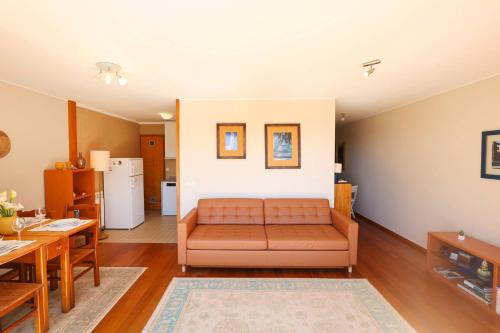 a living room with a couch and a table at Bahia Sea View Apartment in Caminha