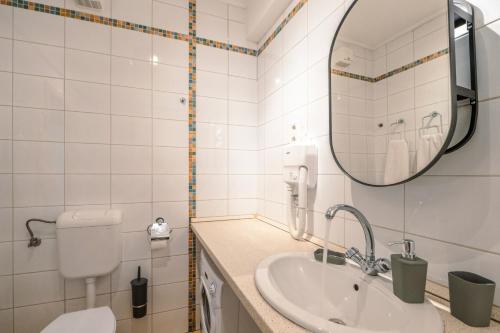 a bathroom with a toilet and a sink at PrimeStayBudapest in Budapest
