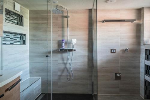 a shower with a glass door in a bathroom at Ferienwohnung Insel Reichenau in Rheinstraße