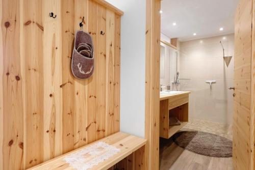 a wooden bathroom with a shoe on the wall at Pfösslerhof in Bolzano