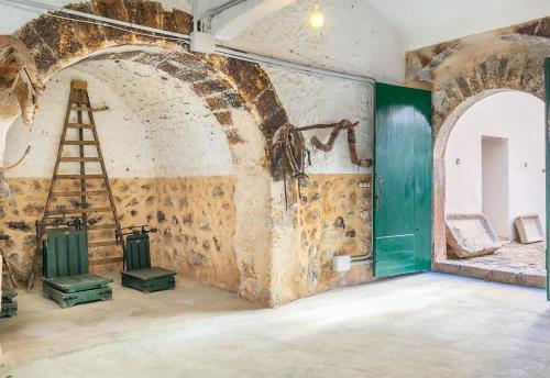 an old room with a ladder on the wall at Historic Finca in Mallorca Up To 8 in Andratx