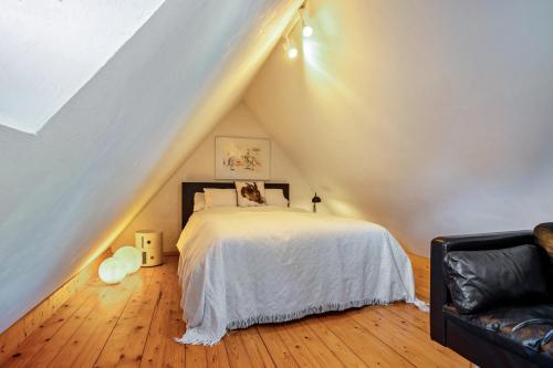 a bedroom with a bed in a attic at Backhaus in Groß Wokern