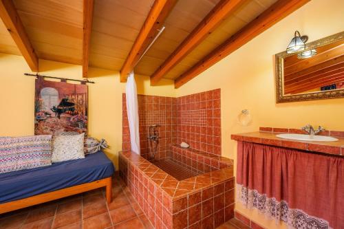 a bathroom with a tub and a sink at Ses Oliveres en Port Verd in Son Servera
