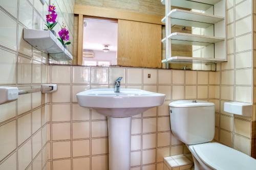 a bathroom with a sink and a toilet at Apartament Luisa in Lloret de Mar