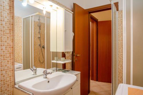 a bathroom with a sink and a shower at Terra in Follonica