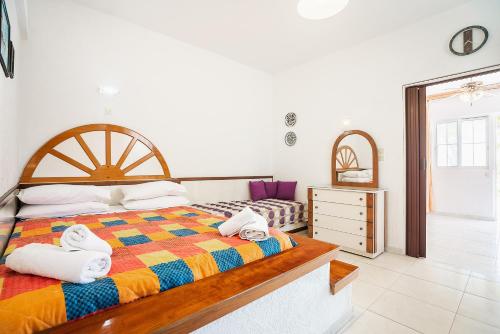 a bedroom with a bed with towels on it at Panorama Tilos Apt A in Tílos