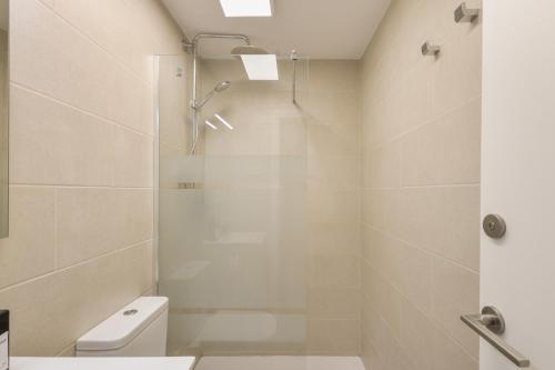 a bathroom with a shower and a toilet at Host Dalies in Premia de Dalt