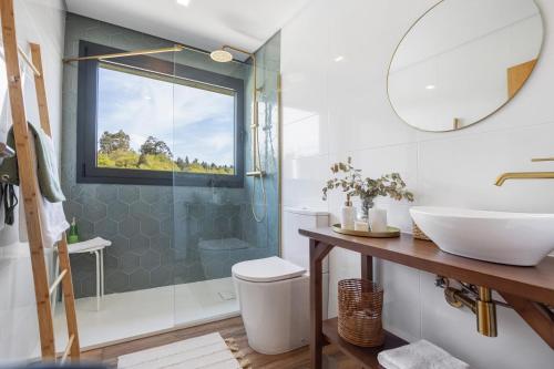 a bathroom with a sink and a shower at Casa Do Mordomo in Arcos de Valdevez
