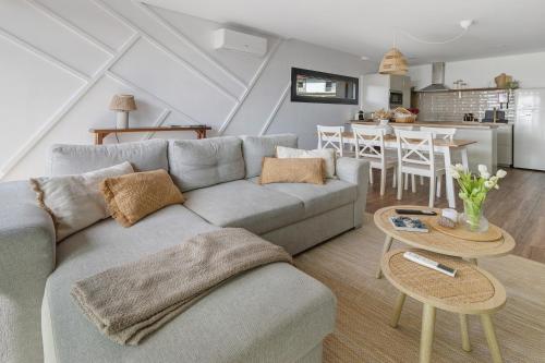 a living room with a couch and a table at Casa Do Mordomo in Arcos de Valdevez