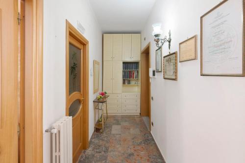 a hallway with a white door and a hallway sidx sidx at Ce Tour - Nonni's Lemon House in Cetara