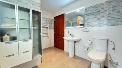 a bathroom with a toilet and a sink at Best Leisure in Playa de Palma in Can Pastilla