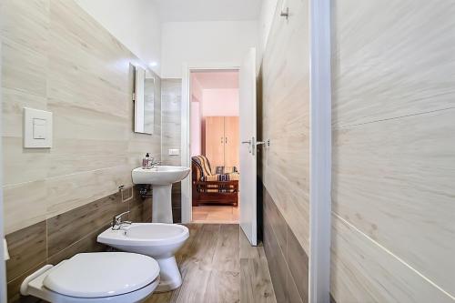 a bathroom with a toilet and a sink at La Mignola - Casa Vacanze in Vieste