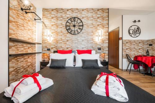 a bedroom with a large bed with red bows at Attilio's House in Capoterra