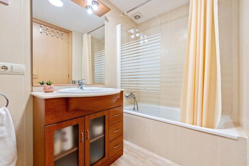 a bathroom with a sink and a tub and a shower at Canana De Vega in Flix