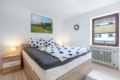 a bedroom with a bed and a window at Blütenzauber in Todtnau
