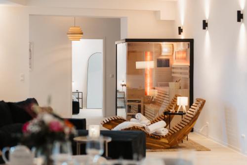 a living room with a couch and a table at Barrierefreies Loft Apartment in Dessau