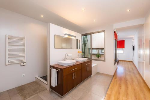 a bathroom with a sink and a mirror at Ca Na Xisca in Sa Pobla