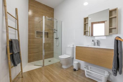 a bathroom with a shower and a toilet and a sink at Vista Valle in La Orotava