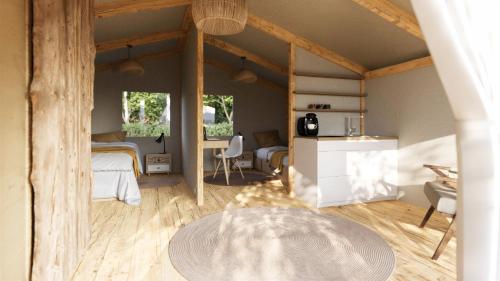 a bedroom with a bed and a table in a room at Eco Camping in Spytkowice