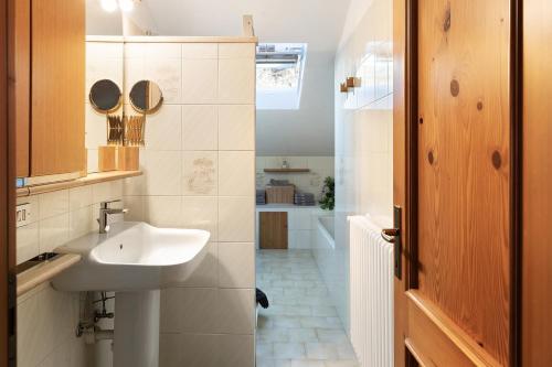 a small bathroom with a sink and a shower at Casa Vacanze Dal Castelin in Sondrio
