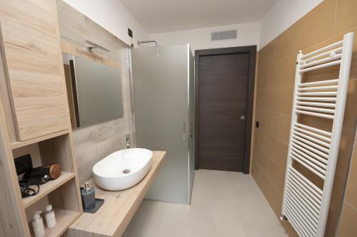 a bathroom with a sink and a toilet in it at Appartamenti Suly 4 - Cir0085 in Saint Vincent