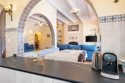 a kitchen counter with a hair dryer in a room at Petit Palau in Port de Soller