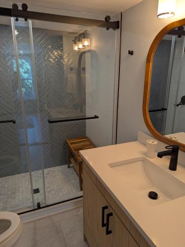 a bathroom with a shower and a sink at Modern Comfort in Marlborough
