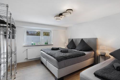 a bedroom with a bed and a window at Fewo Kerbe in Willingen