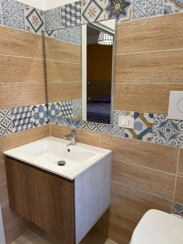 a bathroom with a sink and a mirror at B&B Le Eolie in Milazzo