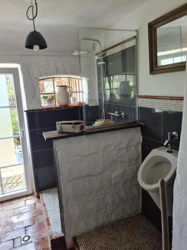 a bathroom with a sink and a toilet at Pepper Huis in Lemgo