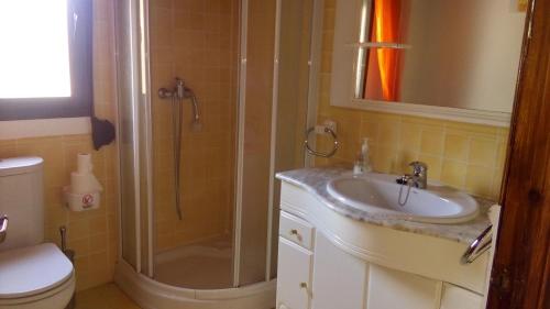 a bathroom with a sink and a shower at Cortijo la Era in Castril