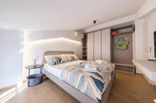 a bedroom with a large bed in a room at Lumeriam Sea Loft in Roccalumera
