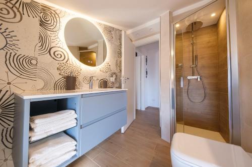 a bathroom with a sink and a shower at Lumeriam Sea Loft in Roccalumera