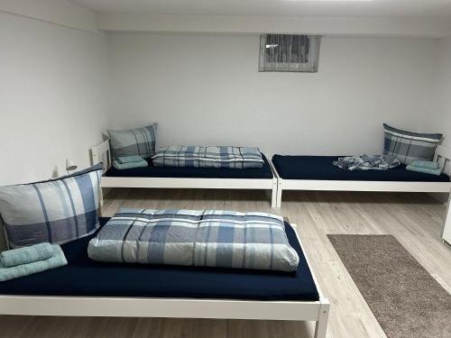 a room with two beds and a couch at Ferienwohnung Princesa in Geilenkirchen