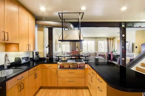 a kitchen with a black counter top and a stove at Two Bedroom, Two Newly Renovated Bathrooms, Deck in San Francisco