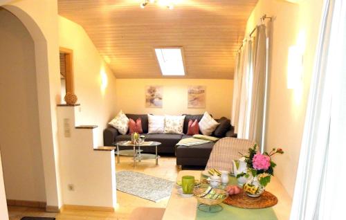 a living room with a couch and a table at Ferienwohnung Zwiesel in Wackersberg