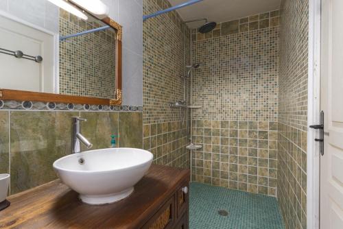 a bathroom with a sink and a shower at Tour Catalane in Ille-sur-Têt