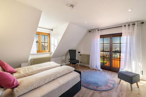 a bedroom with a bed and a large window at Feriendomizil Berta Benzingen 2 in Winterlingen