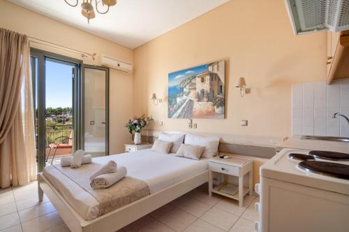a bedroom with a large bed in a room at Nontas Home 21 in Kalamitsi