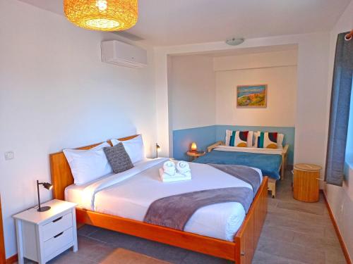 a bedroom with two beds in a room at The Wave House - Two Bedroom Flat in Jardim do Mar