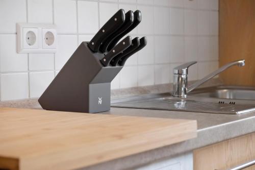 a black knife block sitting on top of a kitchen counter at Gästehaus Schwörer in Lenzkirch