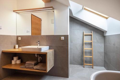 a bathroom with a sink and a mirror at Residence Linderhof in Natz-Schabs