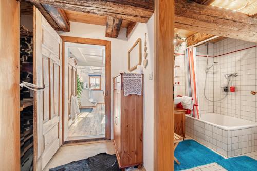 a bathroom with a tub and a toilet and a sink at Schuler-Haus in Balingen